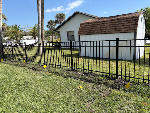 Black aluminum fence installed by Fort Fence Masters
