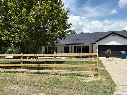 Wooden ranch rail fence with a gate
