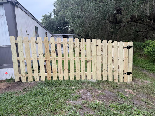 Straight, finished wood picket fence with gate